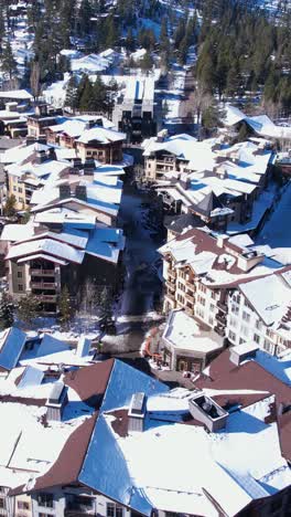 Vertical-Aerial-View,-Palisades-Ski-Resort-Buildings,-Olympic-Village,-Lake-Tahoe-CA-USA