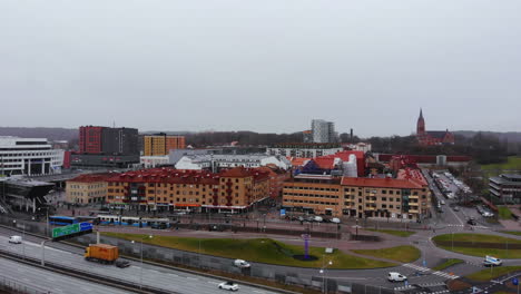 Scenic-View-Of-Vehicles-And-Modern-Buildings-In-Mölndal,-Gothenburg,-Sweden-Under-The-Dramatic-Sky---aerial-drone