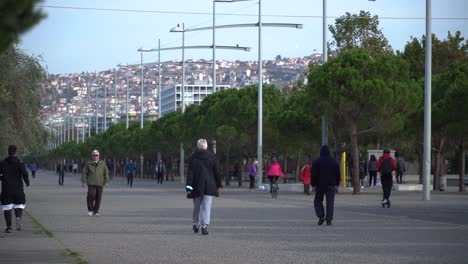 People-walking,-running,-and-biking-in-a-city