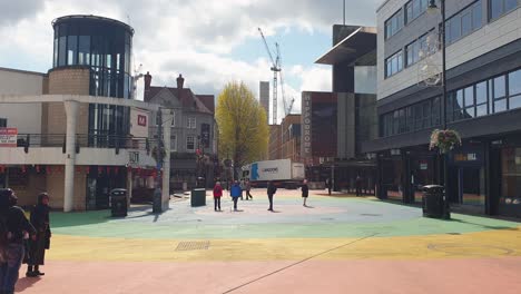 Rainbow-painted-streets-and-pedestrians-in-city-centre-of-Birmingham,-England-UK