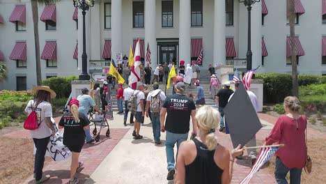 American-patriots-walking-towards-the-Florida-state-capitol-in-Tallahassee-for-a-Free-The-Patriots-rally-for-editorial-purpose