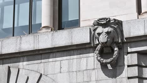 Lions-grabbing-onto-the-walls-at-Montcalm-Royal-London-House,-United-Kingdom