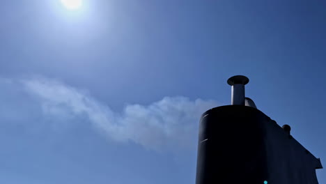 Exhaust-from-a-ferry-boat---isolated-close-up-against-a-blue,-sunny-sky