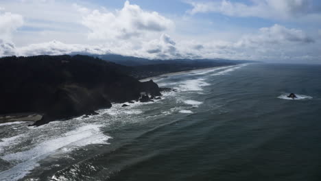 Aerial-Coastline-Landscape-With-Hills-Overlooking-Ocean-Along-Rocky-Shore,-God's-Thumb-Oregon-Coast