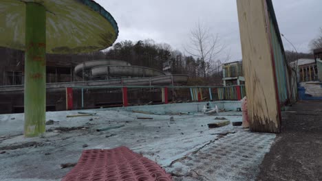 Slider-Footage-of-a-Decaying-Kids-Play-Area-in-an-Abandoned-Fugates-Water-Park-in-Eastern-Kentucky