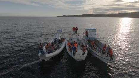 Seafarers-In-Their-Boats-Adrift-On-The-Waters-Of-Patagonian-Sea-On-A-Sunset-After-Their-Nautical-Training---Slowmo