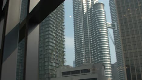 tilt-shot-of-the-petronas-towers-and-eco-towers