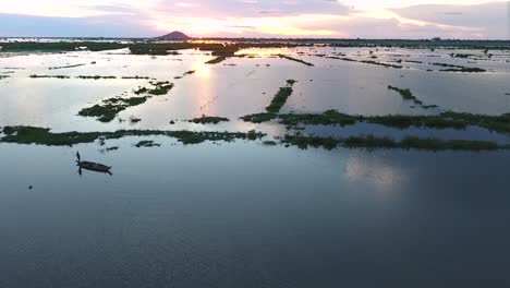 Clip-of-sunset-at-the-countryside-with-the-fisherman-traveled-by-boat-to-go-home