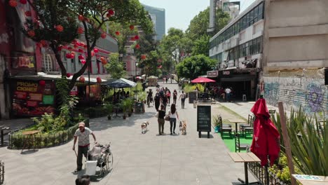 wide-angle-establishing-shot-at-public-square-plaza,-people-walking-in-background