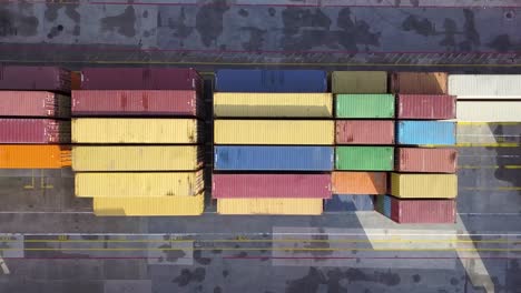 aerial-view-of-cargo-containers-stacked-at-the-port-waiting-for-shipment-at-global-pandemic-lock-down