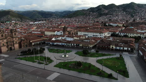 Daytime-4k-aerial-footage-of-Plaza-de-Armas-in-Cusco-City,-Peru-during-Coronavirus-quarantine,-left-to-right-truck-and-pan,-wide-angle-shot