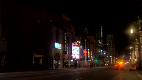 Walk-of-Fame-shop-facades-by-night,-Hollywood-Boulevard-,-Los-Angeles,-California,-US