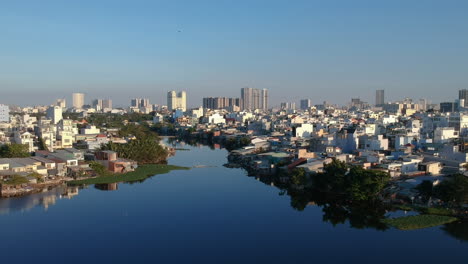 Drone-shot-Flying-over-one-of-the-canals-iof-Ho-Chi-Minh-City,-Vietnam