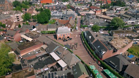 Drone-view-above-Budel-city-centre,-capturing-Markt-central-square-in-this-rural-Brabant-village