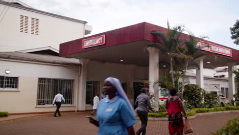 Exterior-of-emergency-hospital-building-in-Africa-with-nurse-walking