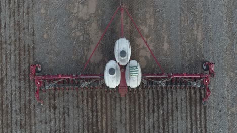 HARVESTERS-LIFTING-CORN-FROM-THE-FIELD,-AERIAL-VIEW