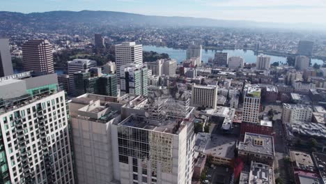 Oakland-CA-USA,-Drone-Shot-of-Downtown-Residential-Towers-and-Parks-by-Lake-Merritt-on-Sunny-Day