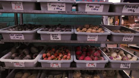 Stockpile-of-Root-Vegetables-in-Industrial-Bins-in-Grocery-Market