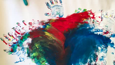 Kid-painting-with-finger-paint