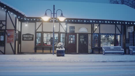 Early-morning-in-Poulsbo-Washington-with-a-rare-snowfall,-a-view-of-a-downtown-gallery