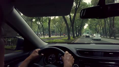 Mature-latin-woman-driving-her-SUV-through-the-streets-of-Mexico-City