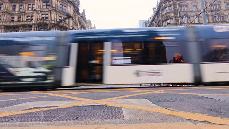 Tram-Moving-On-Tramway-On-Street-In-Edinburgh,-Scotland