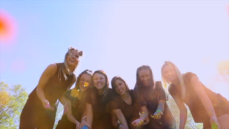 College-girls-throw-colored-powder-in-the-air-in-slow-motion