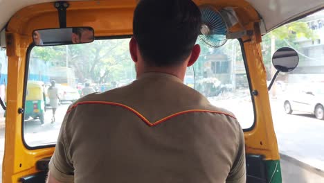 View-from-the-inside-of-an-auto-rickshaw-as-a-riding-passenger-in-Bangalore,-India