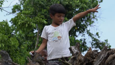 Two-little-Brazilian-boys-looking-at-camera-smiling-and-talking