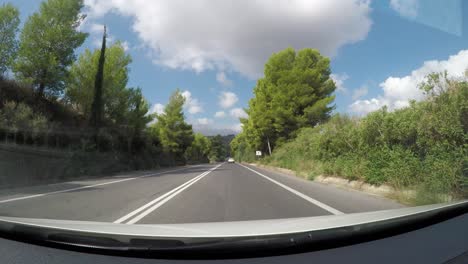 POV-driving-view-through-magical-landscape-of-Crete-island