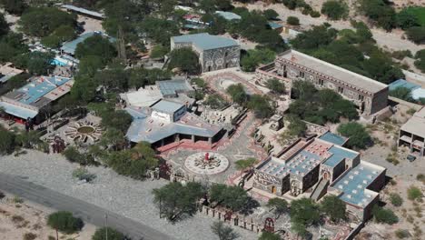 Aerial-Drone-Shot-of-Museum-Complex-Museo-Pachamama-in-Hot-Desert-Climate-Region