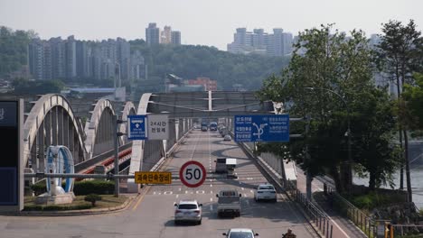 Aerial-shot-of-cars-commuting-in-heavy-traffic-on-a-freeway-in-Asia