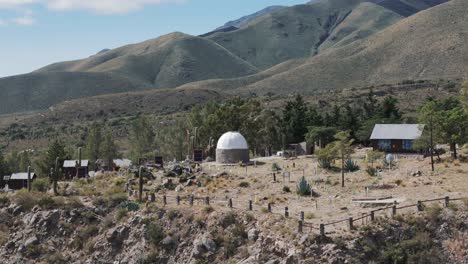 Scenic-aerial-of-astronomic-observatory-tower-in-the-Amaicha-del-Valle-mountains-in-Argentina