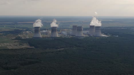 Aerial-View-of-Modern-Nuclear-Power-Plant-Surrounded-by-Vast-Forest-in-Ukraine