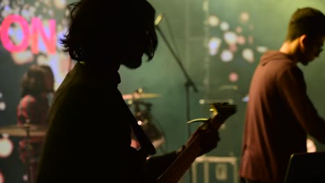 Silhouette-of-a-guitarist-playing-his-guitar-at-an-architectural-college-fest-in-Kerala