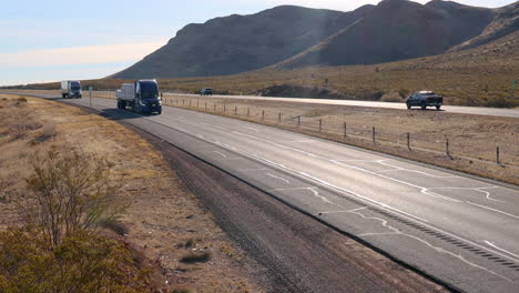 Semi-tractor-towing-a-flatbed-trailer-full-of-product-across-southwest-Texas