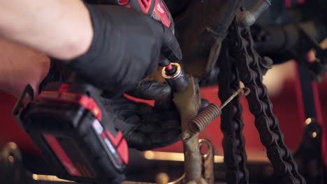 Close-Up-of-Hands-Using-Power-Tools-During-Motorcycle-Teardown