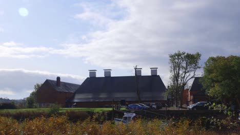 Snape-Maltings-in-Suffolk-on-a-sunny-day-with-clouds-behind-main-building