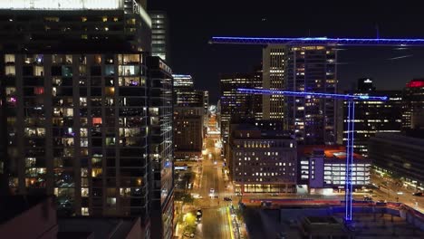 Drone-shot-through-quiet,-nighttime-streets-of-downtown-Phoenix,-Arizona,-USA