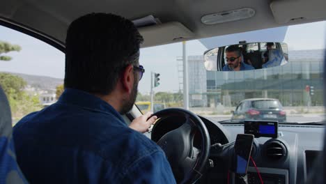 Backseat-passenger-point-of-view-in-Turkish-taxi,-Kusadasi,-Turkey