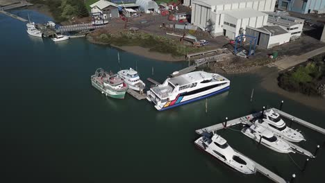 Aerial-4K-pull-back-from-boat-factory-with-lots-of-boat-around-the-marine-in-Auckland