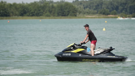 Lifesaver-with-jet-ski-floating-on-lake-and-searching-missing-person