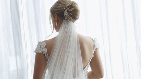 Bride-stands-alone-before-her-ceremony