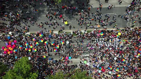 Gay-pride-parade-walking-on-the-streets-of-Mexico-city---birdseye,-aerial-view