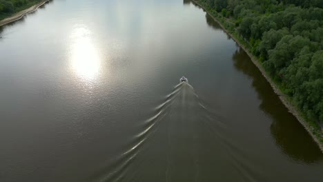 Aerial-reveal,-Warsaw-capital-city-skyline-silhouettes,-river-transport