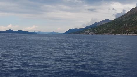 A-scene-captured-from-a-boat-drifting-on-the-tranquil-sea-waters-of-the-Elafiti-Islands,-Croatia,-embodying-the-concept-of-serene-maritime-exploration-and-natural-beauty