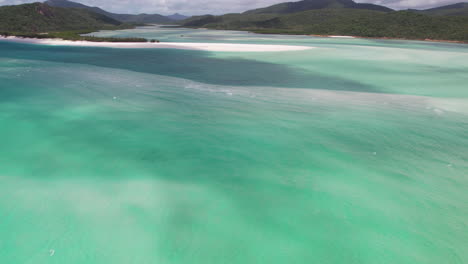 Revealing-Drone-Shot,-Whitehaven-Beach-on-Whitsundays-Island,-Natural-Landmark-of-Australia