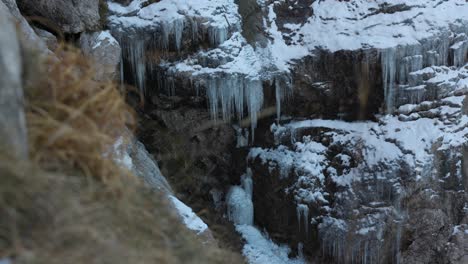 Resegone-Rocks-With-Icicles-In-Lecco,-Italy---Handheld-Shot