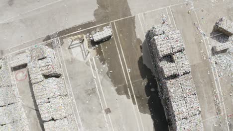 Aerial-top-view-of-paper-wastes-stacked-up-in-waste-treatment-plant-in-France-during-afternoon