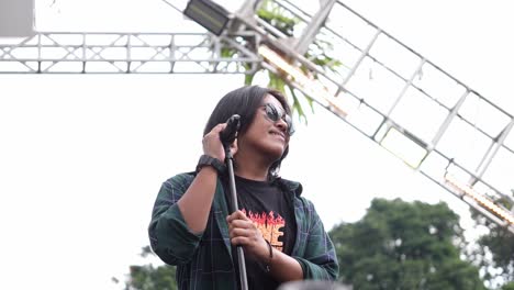 A-singer-in-sunglasses-performs-at-the-Sunset-di-Kebun-outdoor-concert-event